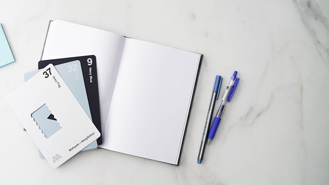Calendar and event invitation cards laid on a marble table