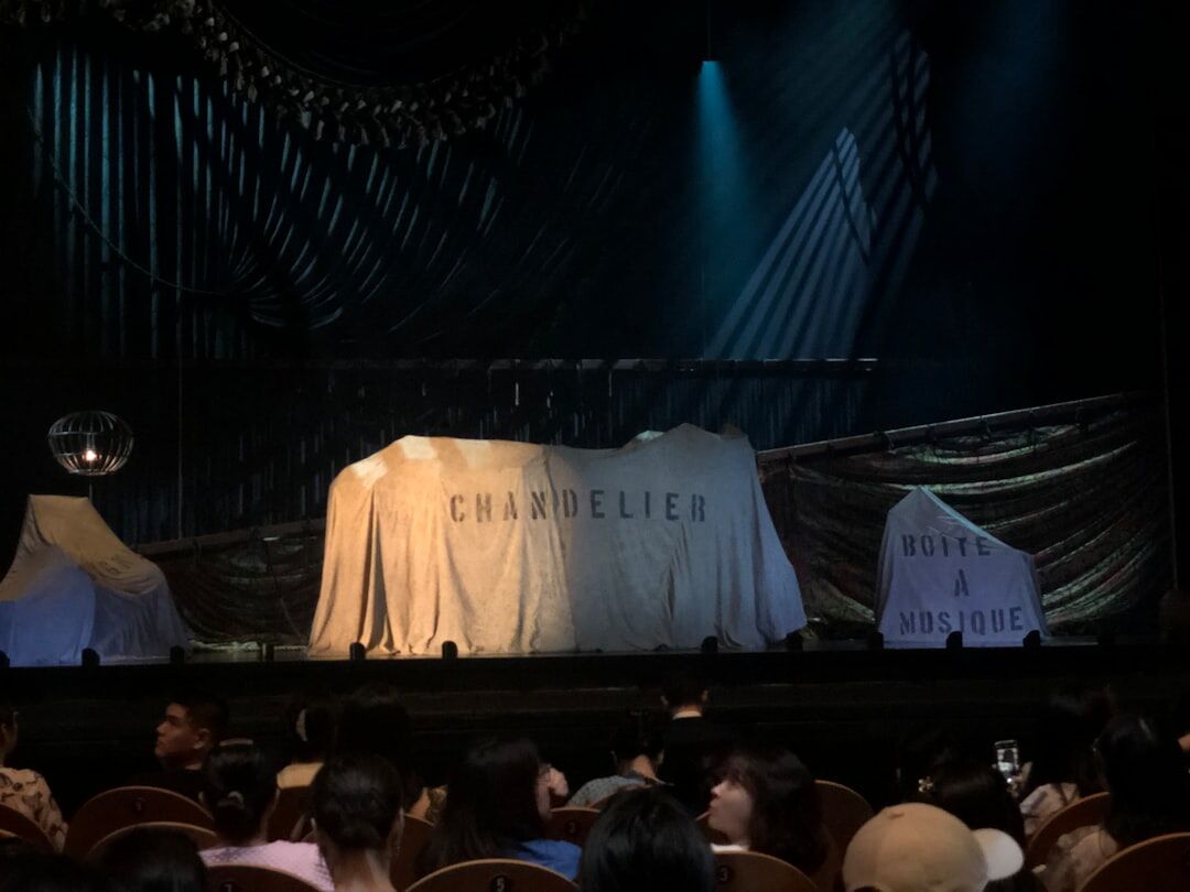 Backstage view of theater curtains before a performance