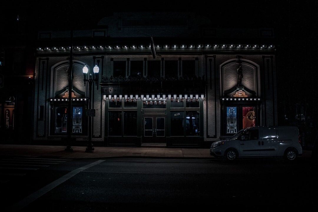 Cinema marquee lights at dusk in a historic theater district